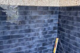 What navy blue paint color would match with our tiles? Please include the brand