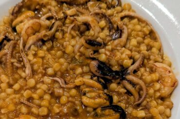 Fregula (a semolina pasta from Sardinia) with seafood and seada (a fried pastry from Sardinia filled with pecorino cheese and drizzled with honey)