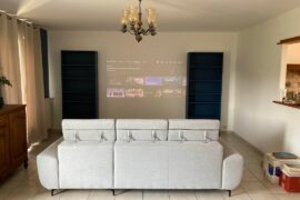 Bookcases on one wall or symetrical with TV inbetween ?