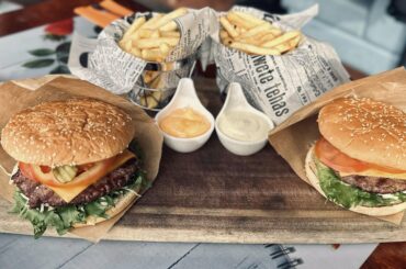 Meal for two: burgers, fries and sauces