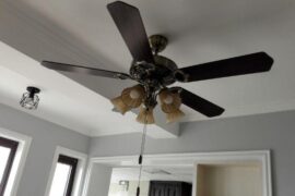 Which floor tile color goes best with blue-grey walls and black walnut furniture?