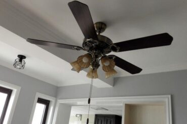 Which floor tile color goes best with blue-grey walls and black walnut furniture?