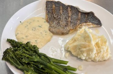 Black Bream, mash, broccoli and white sauce with chopped chives