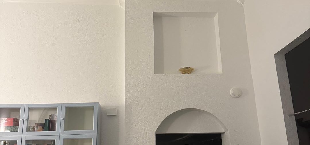 What to do with this awkward wall niche (with light fixture)?