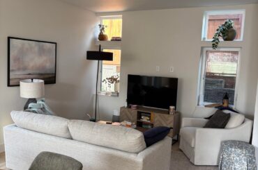 Fireplace size help - fill the wall or leave space?