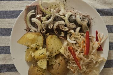 Herrings with onions, potatoes and cabbage salad