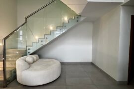 How would you transform this awkward under-stairs space into something warm and inviting?