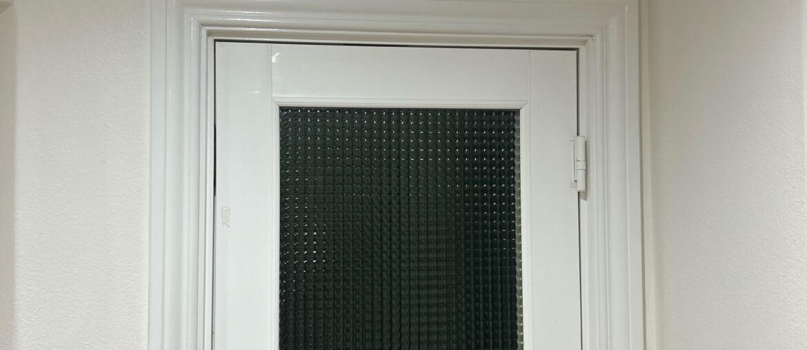 Looking to add curtain to French door