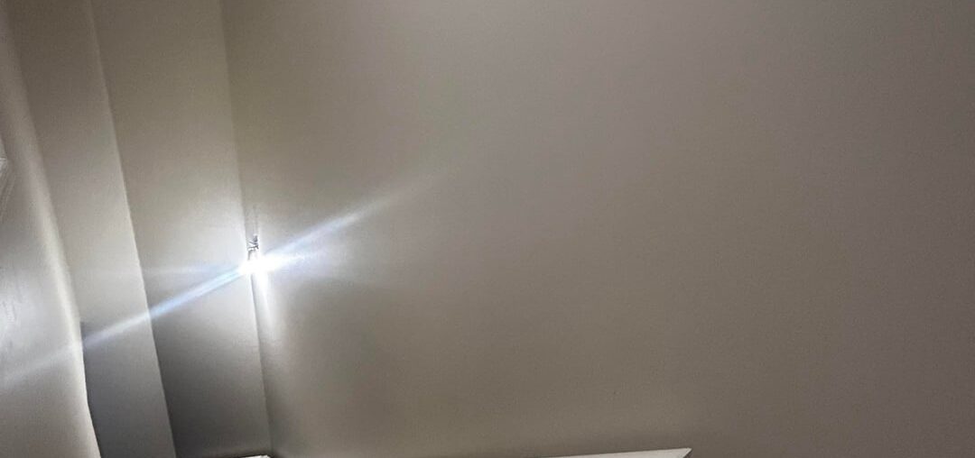 What would look good on the wall above railing?