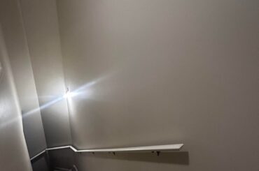 What would look good on the wall above railing?