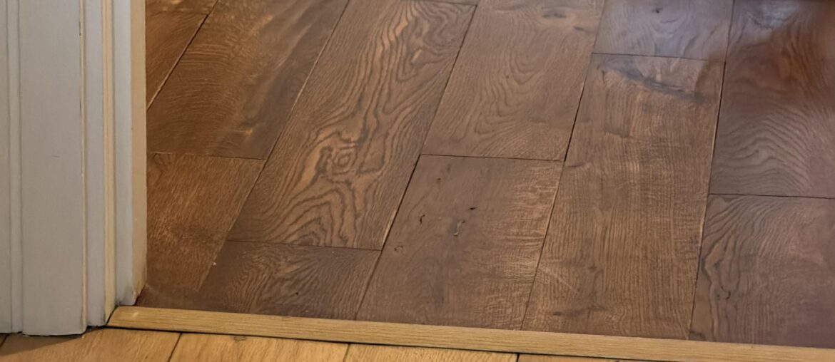 Is it aesthetically acceptable to have different wood stain for bedrooms and living room/hallway in an apartment?
