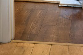 Is it aesthetically acceptable to have different wood stain for bedrooms and living room/hallway in an apartment?