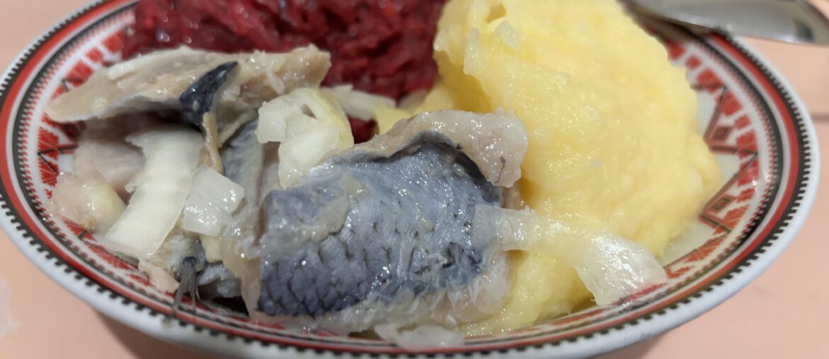Dinner in my military unit somewhere in Ukraine: mashed potato, boiled beetroot salad, and salted herring served with onion