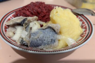 Dinner in my military unit somewhere in Ukraine: mashed potato, boiled beetroot salad, and salted herring served with onion