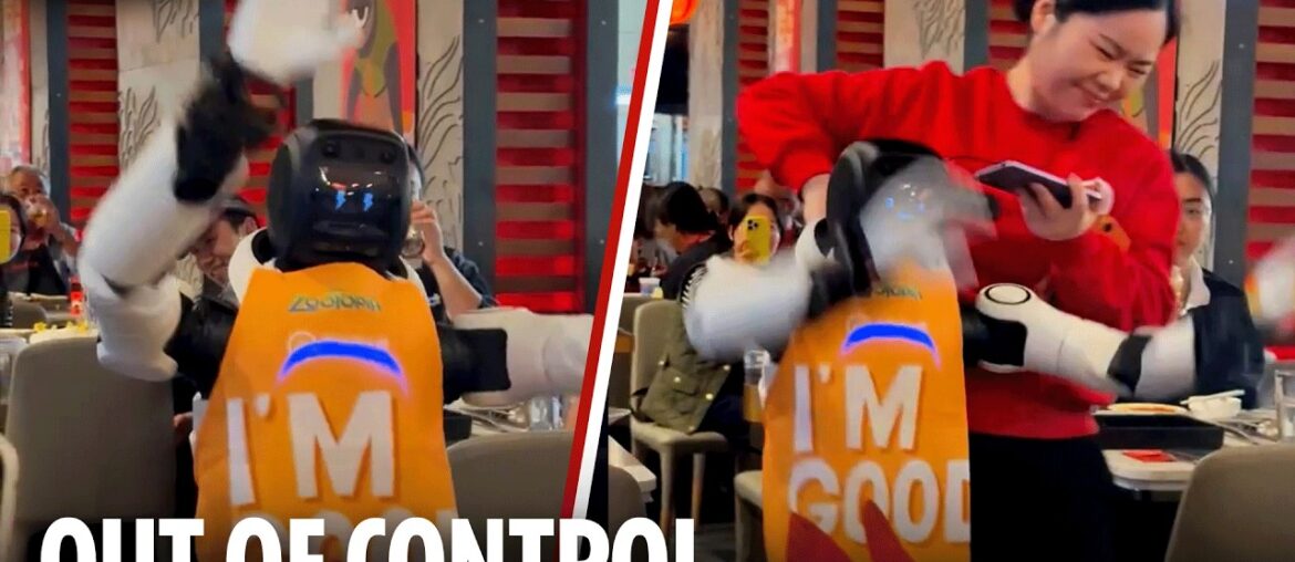 Out of control robot smashes up restaurant as waitress desperately attempts to drag it away