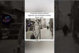 A French woman with her baguette and six bottles of wine, Paris, 1945.
