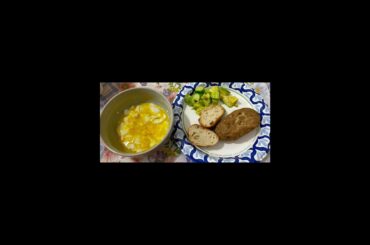Wednesday dinner: eggs, baked potato, French bread, avocado, and crunchers.