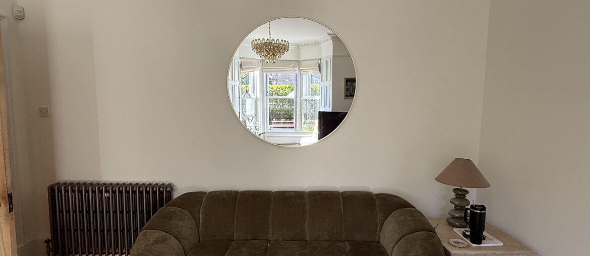 Mirror eye level but is it too high above couch?