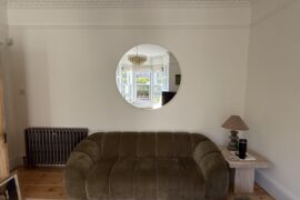 Mirror eye level but is it too high above couch?