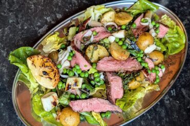 BBQ lamb and spring onions, new potatoes, peas & mint