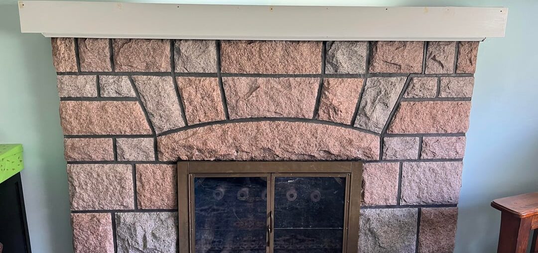 Is there anything I can do (cheaply) to make this fireplace not so dated-looking?