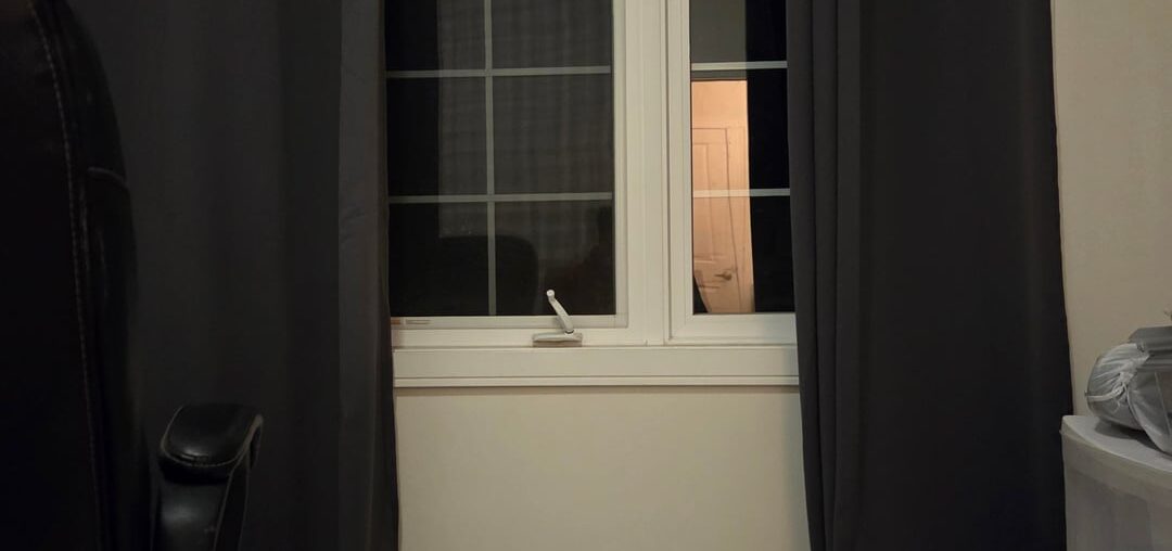 Can I place a tv and tv stand with a window behind it?