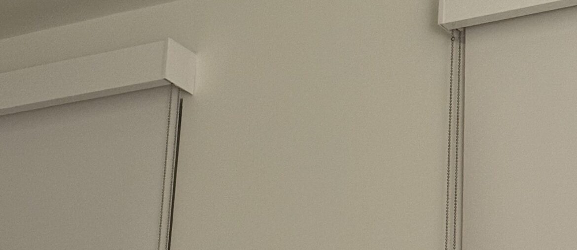 How the heck do I hang curtain rods over these wide mounted blinds?