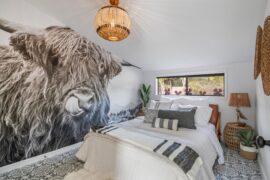 Designed this bedroom around a massive Highland Cow mural. Is the oversized scale too much, or just enough? 🐮🌾🤗