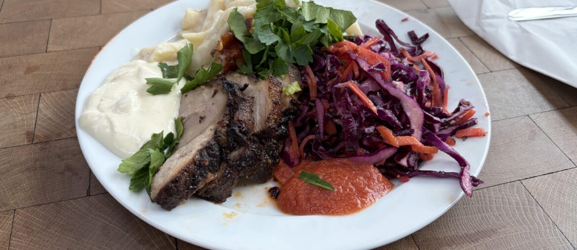 Jerk-marinated pork, mac & cheese, salad and condiments