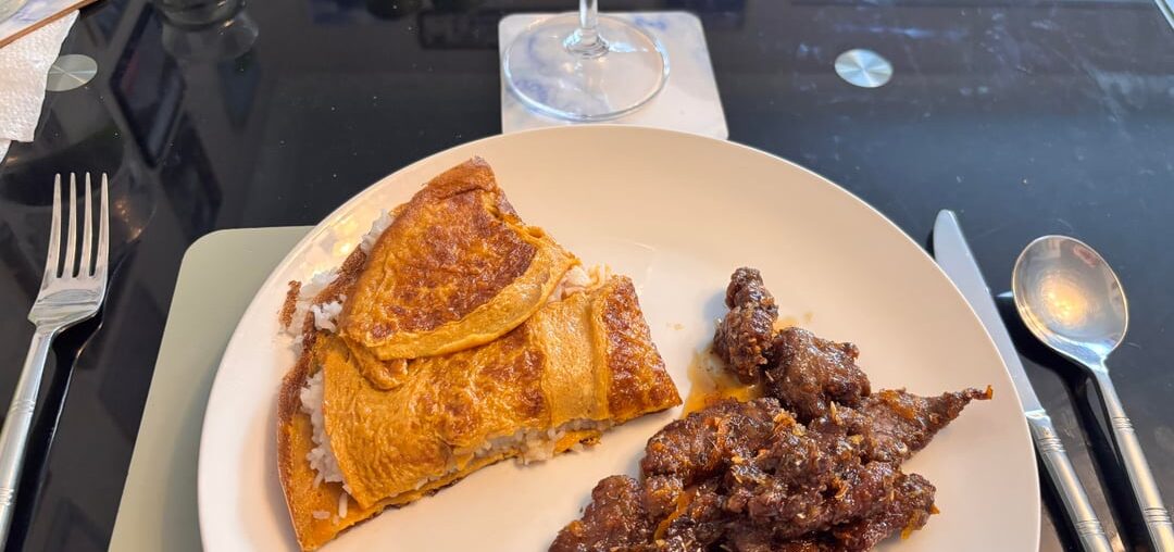 Crispy chilli beef with a version of a rice omelette.