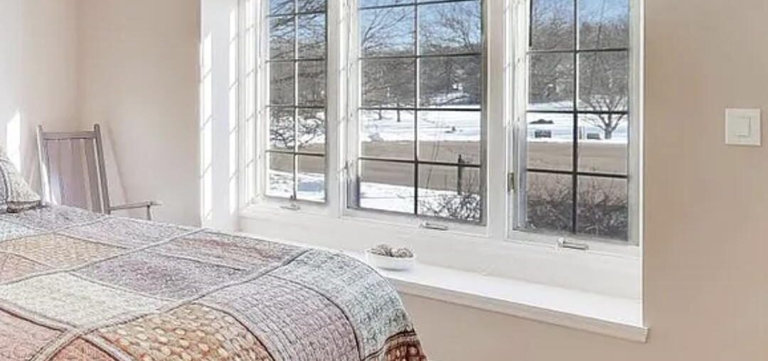 Where should I hang blackout curtains for this window that has a small bench? And how long should they be?