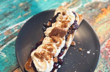 Warm ciabatta, cream cheese, warm cherry jam and whipped cream