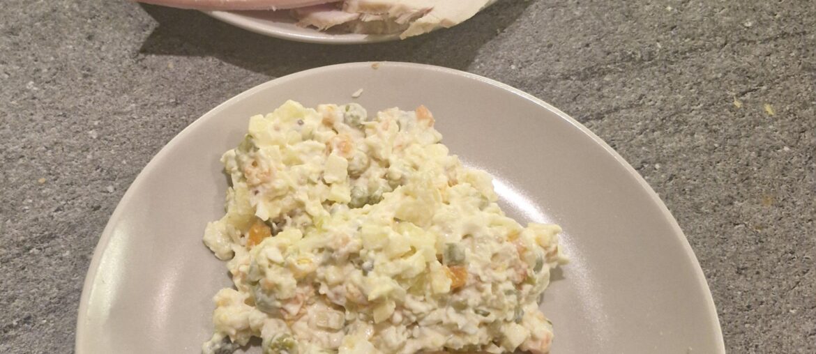 Easter supper-roasted white sausage, vegetable salad and different ham variations