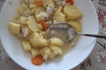 Hake,potato and carrot stew for lunch,cooked in hake broth,seasoned with olive oil,salt,pepper,chopped fresh garlic and parsley.