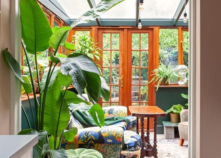 Timber-framed conservatory with garden views in a three-bedroom Victorian terraced house, Telegraph Hill, southeast London, England [711x1067]