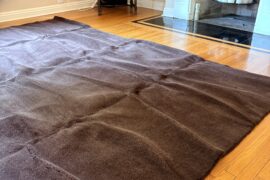 How to flatten a folded rug?