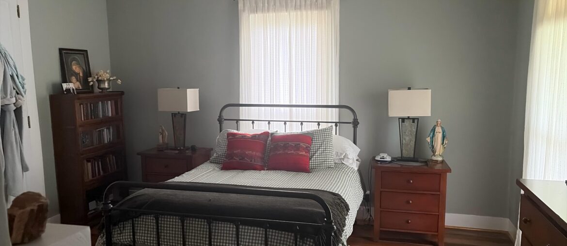 What , if anything I should hang on the wall behind bed and lamps