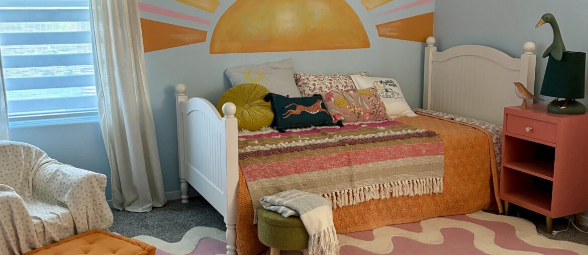 Update on my daughter’s room, chair and night stand aren’t working in my opinion.. what should I do above the headboard?