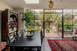 Living and dining space opening up to the patio garden in a renovated 19th-century house, Cheltenham, Gloucestershire, England [1600x1067]