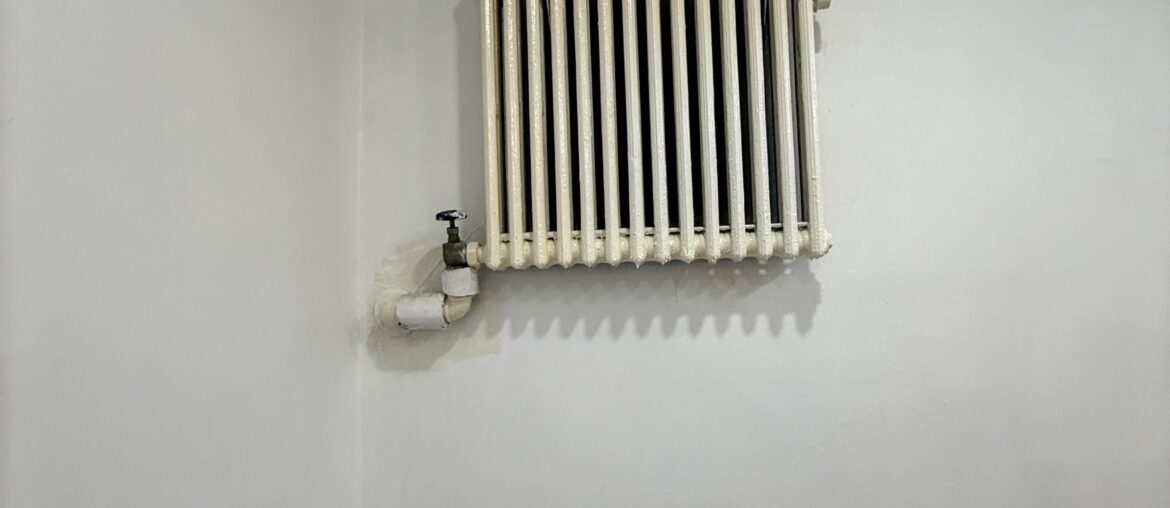 How would you cover or decorate this ugly wall radiator?