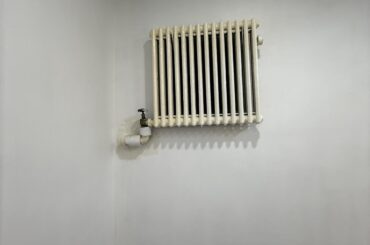 How would you cover or decorate this ugly wall radiator?