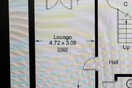 Help! How can I put these sofas in the lounge without covering the door.