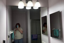 Any ideas on how to camouflage this medicine cabinet?