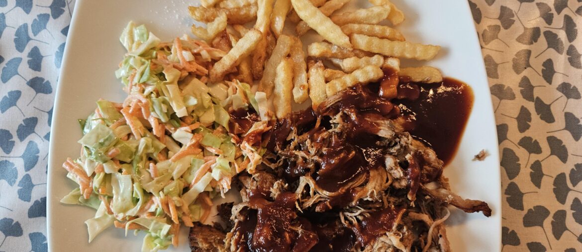 Homemade pulled pork and cole slaw with frites from a bag. Homemade cola barbecue sauce.