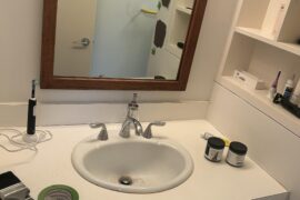 Do a mini facelift for our guest bathroom. Painting the walls, want to replace the sink. Should I go ahead and pull out the whole vanity as well? Can I tile over the vanity? Any other ideas? Not sure what to do to improve the nook on the right as well.