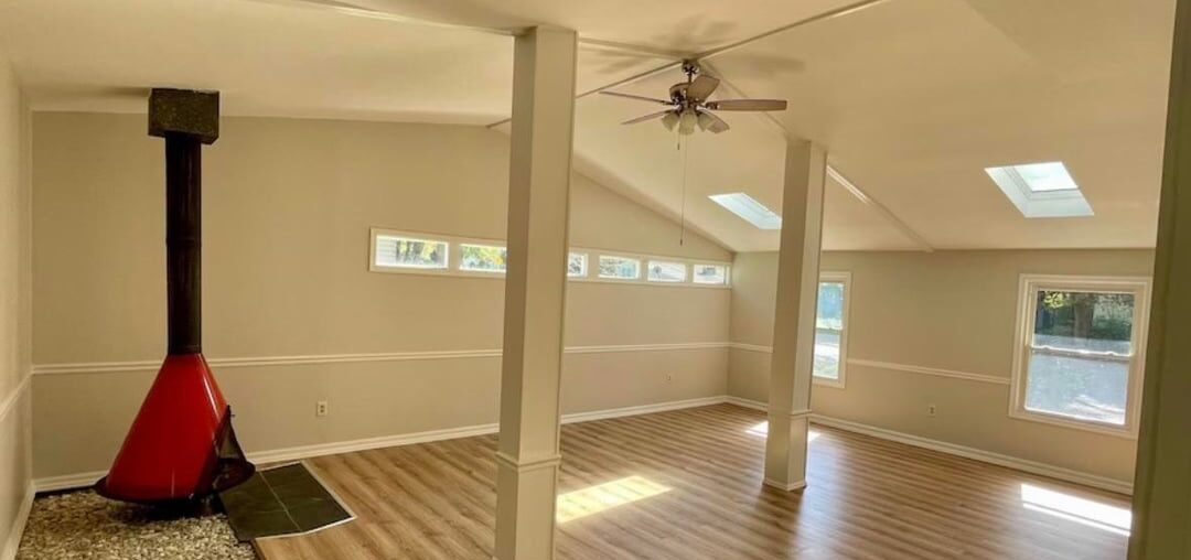 How would you make a room with beams like this functional as a family room?
