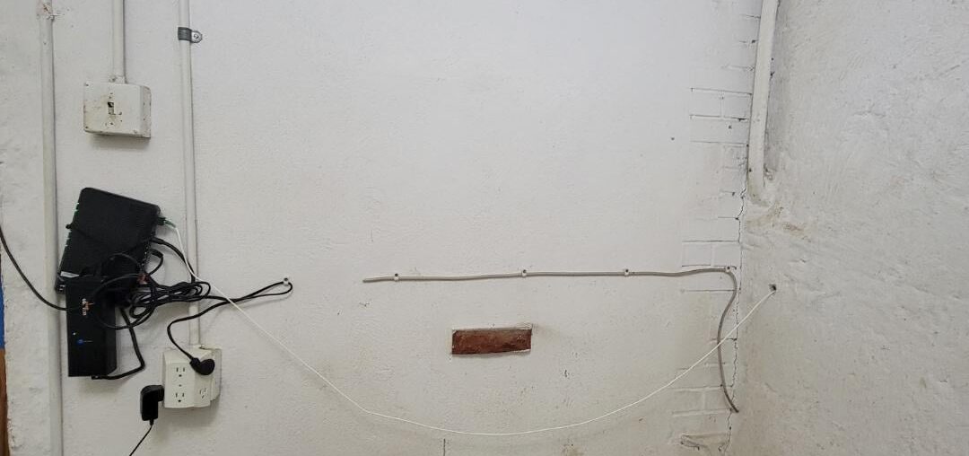 How to make this wall look better / hide electrical?