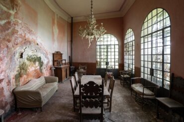 Dining room inside abandoned Italian mansion [OC] [5478x3652]