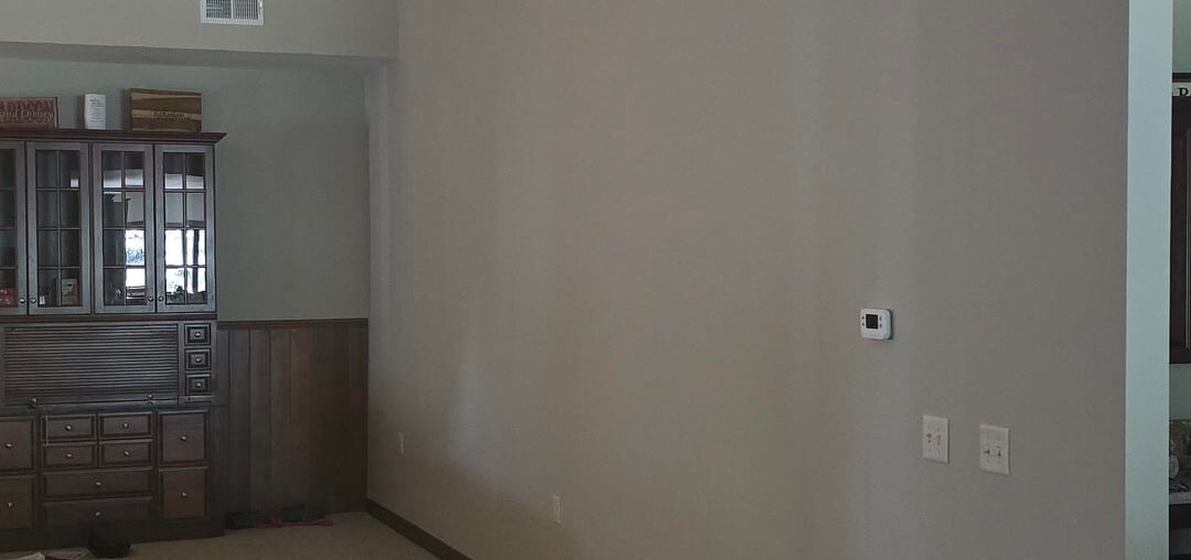 Could I please get help decorating this very large wall in our living area?
