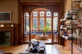 Tall stained-glass bay window with window seats and decorative timber framing in a 19th-century Victorian residence, St Leonards-on-Sea, Hastings, East Sussex, England [1600x1067]